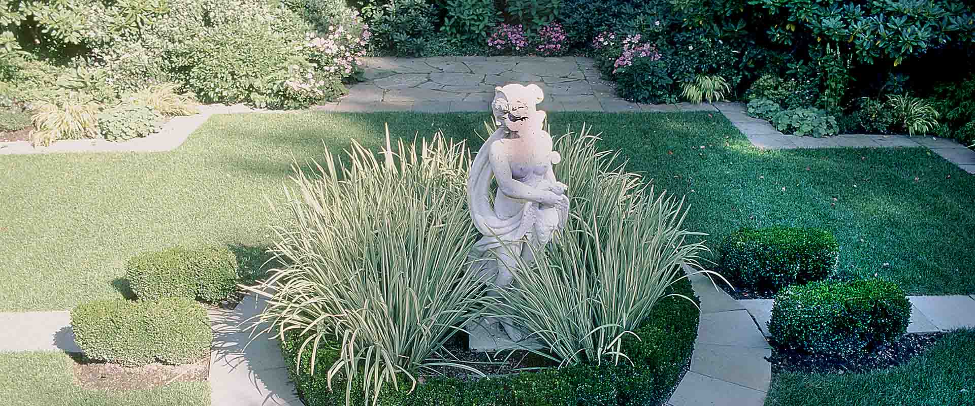 Colonial Style Garden by Rivi Oren